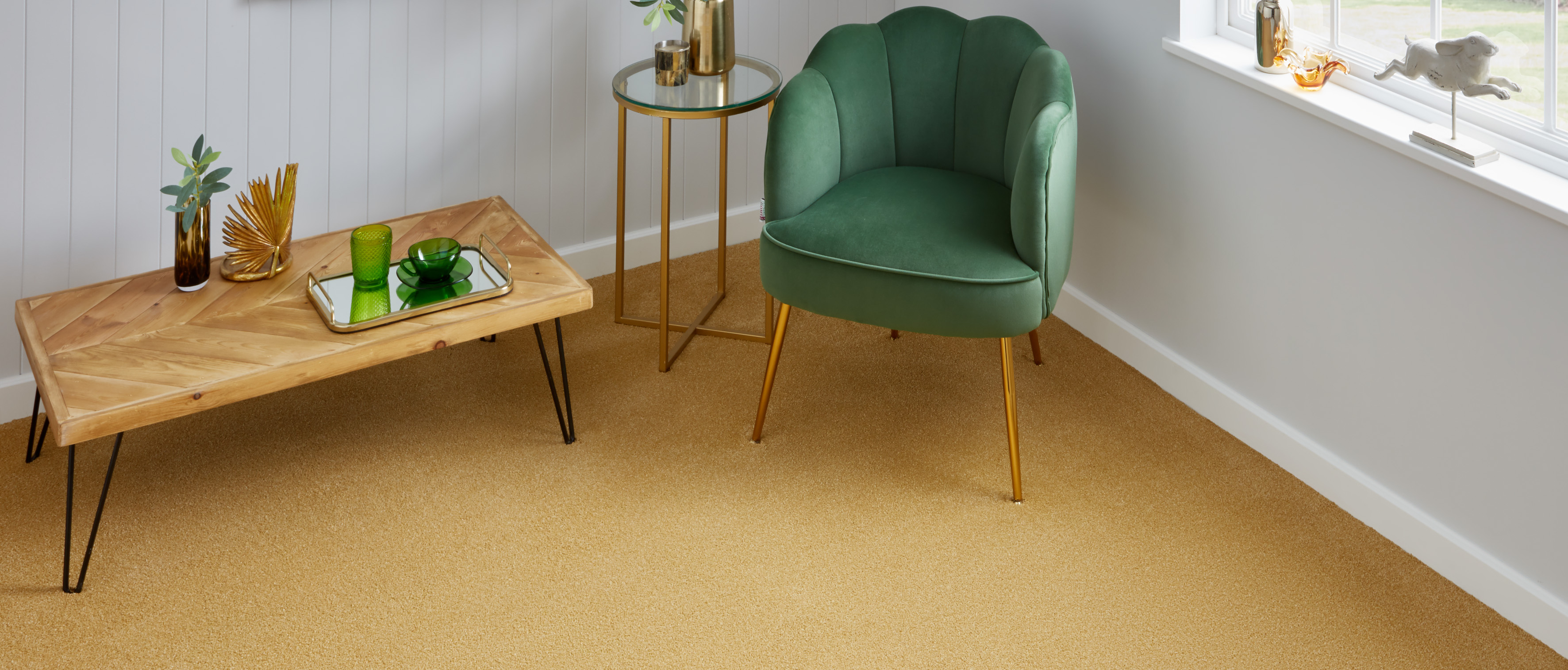 Mustard golden yellow carpet in living room with green velvet chair